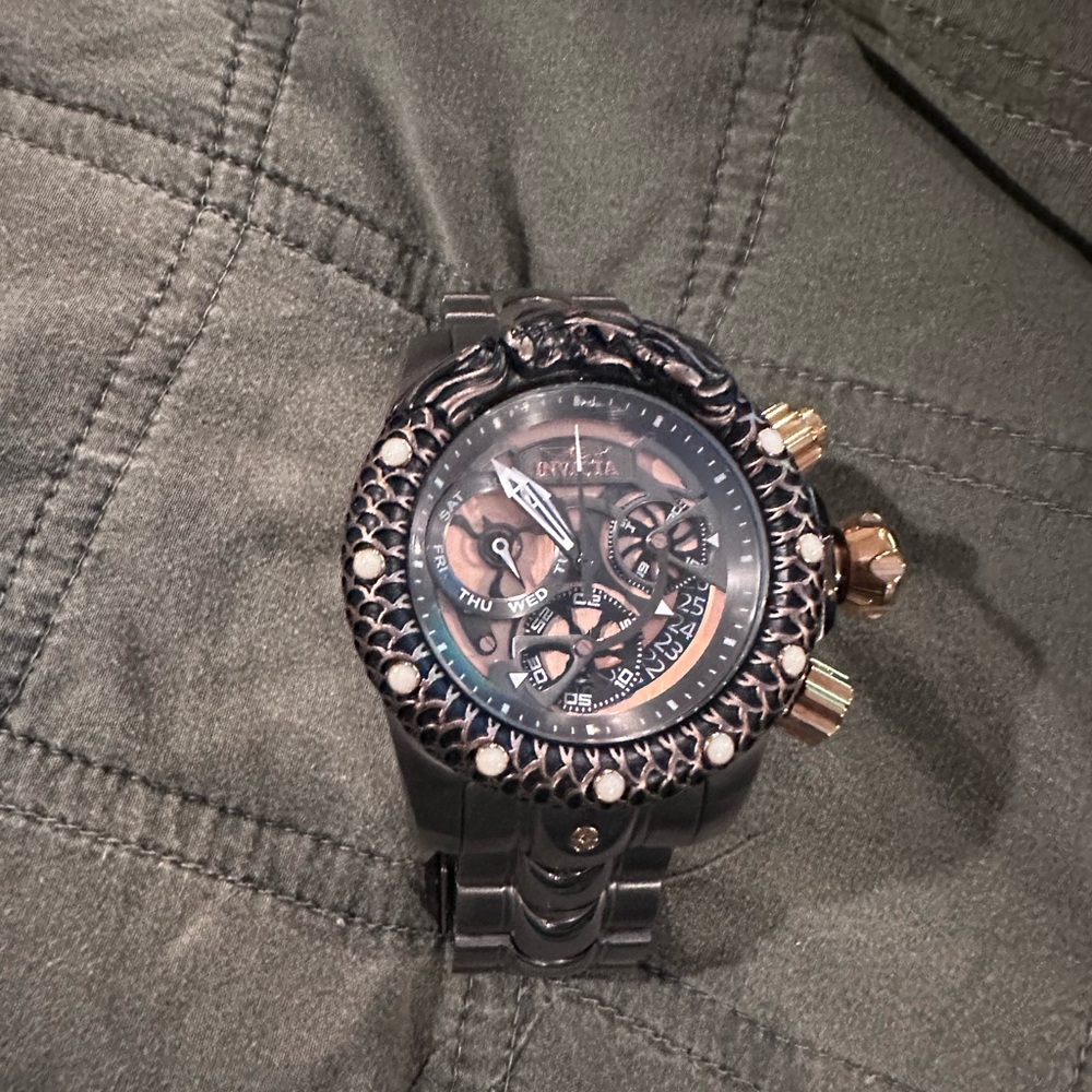 Intricate Black and Gold Watch